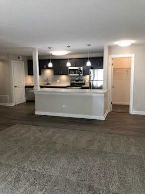 Beautiful, Open Concept Kitchen With Huge Island & Pendant Living Overlooking Living Room