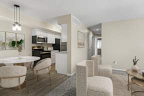 A modern kitchen with a dining table and chairs.