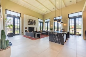 a large open living room with a fireplace and a large kitchen with a large island at Avery Ranch, Austin, 78717