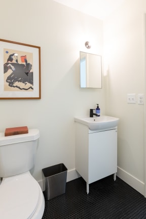 a small bathroom with a white toilet and sink