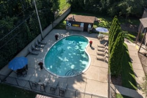 an aerial view of a backyard swimming pool