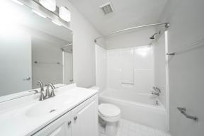 a bathroom with a sink toilet and a shower