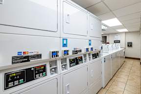 a row of white utility machines in a room