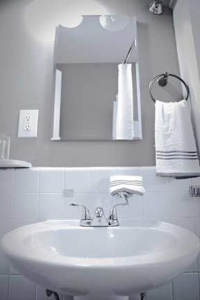 Modern bathroom with pedestal sink.