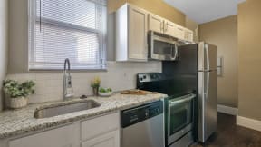 a kitchen with a sink and a refrigerator