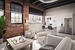 Red Arrow Lofts Livingroom with exposed brick in Corktown Detroit.