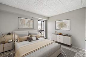 A bedroom with a large bed and a nightstand with a lamp.