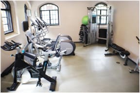 a room with a lot of exercise equipment in it