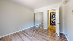 an empty room with a washer and dryer in it and a laundry room at Charter Oaks Apartments, California, 91360