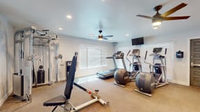 a home gym with exercise equipment and a ceiling fan at Charter Oaks Apartments, California, 91360