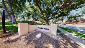 a sign on the side of a street at Charter Oaks Apartments, California, 91360