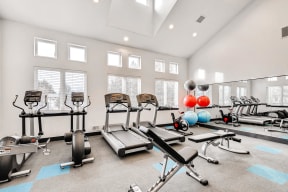 Apartments For Rent in Denver CO - Allure Apartments Fully EquippedFitness Center With Windows And Mirrored Wall
