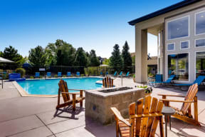 Apartments for Rent in Denver - Allure Apartments Pool Surrounded by Lounging Area