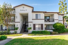 Exterior View of Barrington Place Apartments Building Surrounded By Lush Landscaping at Barrington Place, Rancho Cucamonga, CA, 91739