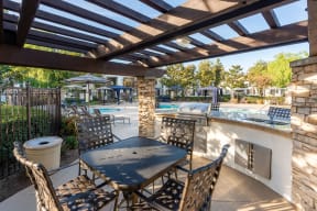 BBQ Station With Picnic Area Next To The Pool, Hot Tub, Umbrellas, Gazebos, And Lounge Chairs. at Barrington Place, Rancho Cucamonga, CA, 91739