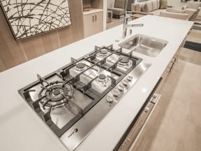 Clubroom kitchen stovetop at MODE, San Mateo, CA