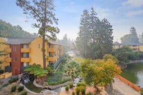 Apartments for Rent in Mountain View, CA - Americana - Orange and Yellow Apartment Building Overlooking A Lake