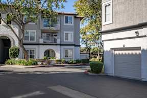 A tree is in front of a building at Missions at Chino Hills Apartments, Chino Hills, CA