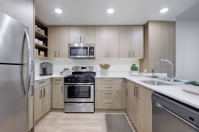  Kitchen with Woodstyle Cabinetry, Sleek Countertops, and Stainless Steel Appliances at MODE, San Mateo, CA, 94403