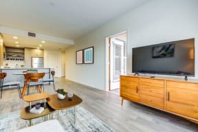 Living, dining, and kitchen area with door to balcony at MODE, California, 94403