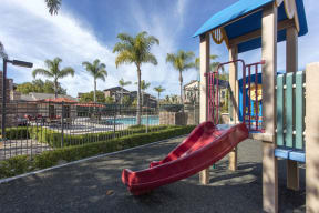 Rancho Bernardo, San Diego Apartments - The Reserve at 4S Ranch - Fenced in Playground on Soft Playground Base, Adjacent to Pool