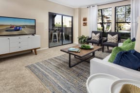 Rancho Bernardo, San Diego Apartments-The Reserve at 4S Ranch-Living Room with Carpet Flooring, Large Windows, and a Large Sliding Door