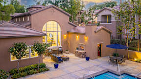 A house with a pool in the backyard. at Sonoma at Mapleton Apartments, West Murrieta, CA