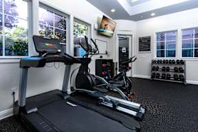 A black treadmill with a digital display in a well lit room. at Sonoma at Mapleton Apartments, West Murrieta, CA 92563