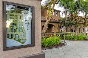 A map of a Sony housing development is displayed on a wall. at Sonoma at Mapleton Apartments, West Murrieta