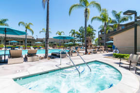 Rancho Bernardo Apartments-The Reserve at 4S Ranch-Sparkling Pool with Spa, Lounge Seating, and Umbrellas