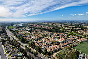 A suburban neighborhood with houses and a road.