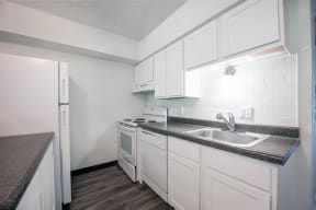 the preserve at ballantyne commons apartment kitchen with white cabinets
