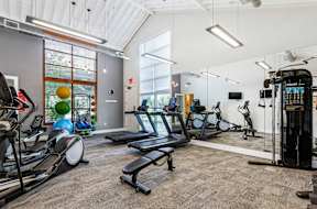 Fitness center with cardio and weight equipment at Mullan Reserve Apartments, Missoula