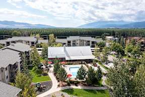 Aerial view of residential community with mountain backdrop at Mullan Reserve Apartments, Missoula, 59808