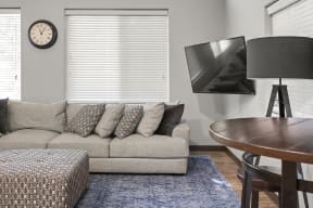 a living room with a couch and a table at Mill Pond Apartments, Auburn