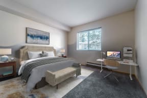a bedroom with a bed and a desk at Mill Pond Apartments, Washington, 98092
