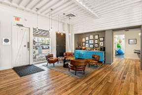 Lobby entrance with seating area and rustic decor at Mullan Reserve Apartments, Montana