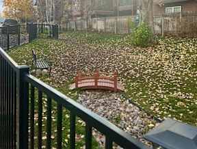 Backyard with decorative bridge and garden bench at Mullan Reserve Apartments, Missoula, 59808