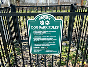 Dog park rules sign on black fence at Mullan Reserve Apartments, Missoula, MT 59808