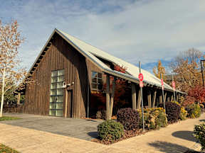 Covered walkway with wood siding and modern roof at Mullan Reserve Apartments, Missoula, 59808