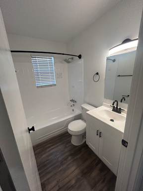 A bathroom with a toilet, sink, and a window.