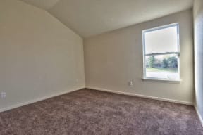 an empty room with a window in it