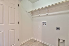 an empty room with a white wall and a white door