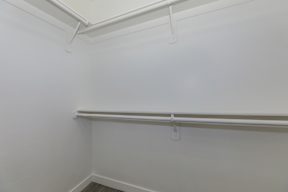 A white wall with a white ceiling and a white floor.
