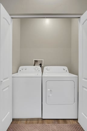 A small laundry room with two washing machines.