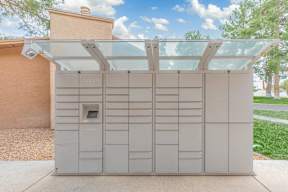 A small building with a glass roof and a door with a keypad.