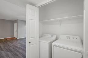 A laundry room with a washer and dryer.