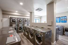 A row of washing machines in a public laundromat.