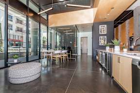 A modern kitchen with a dining table and chairs.