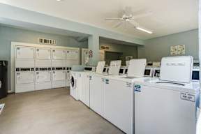 A row of washing machines in a laundromat.